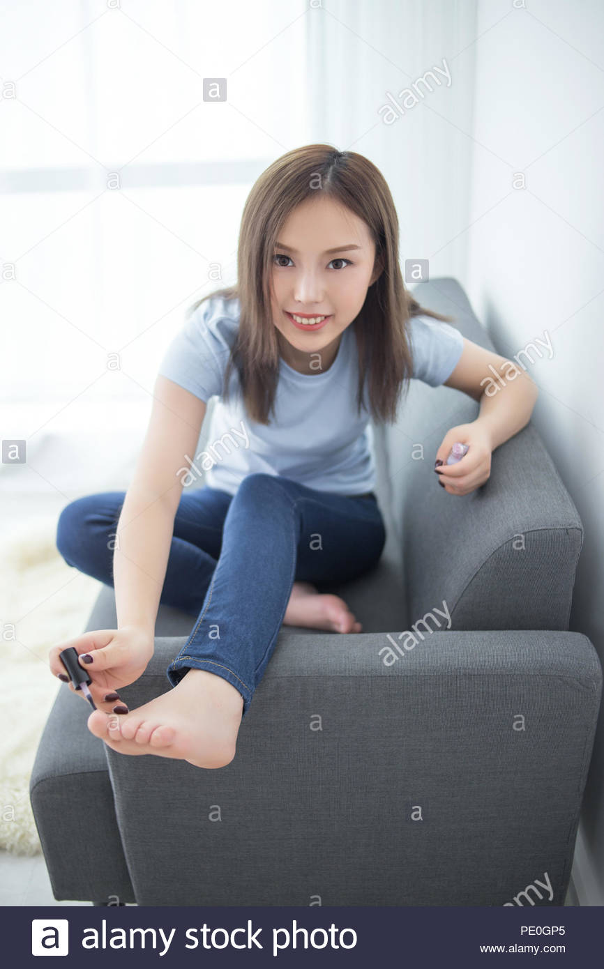 Girl Sit On Couch Paint Nail Polish Stock Photo 215142765 Alamy