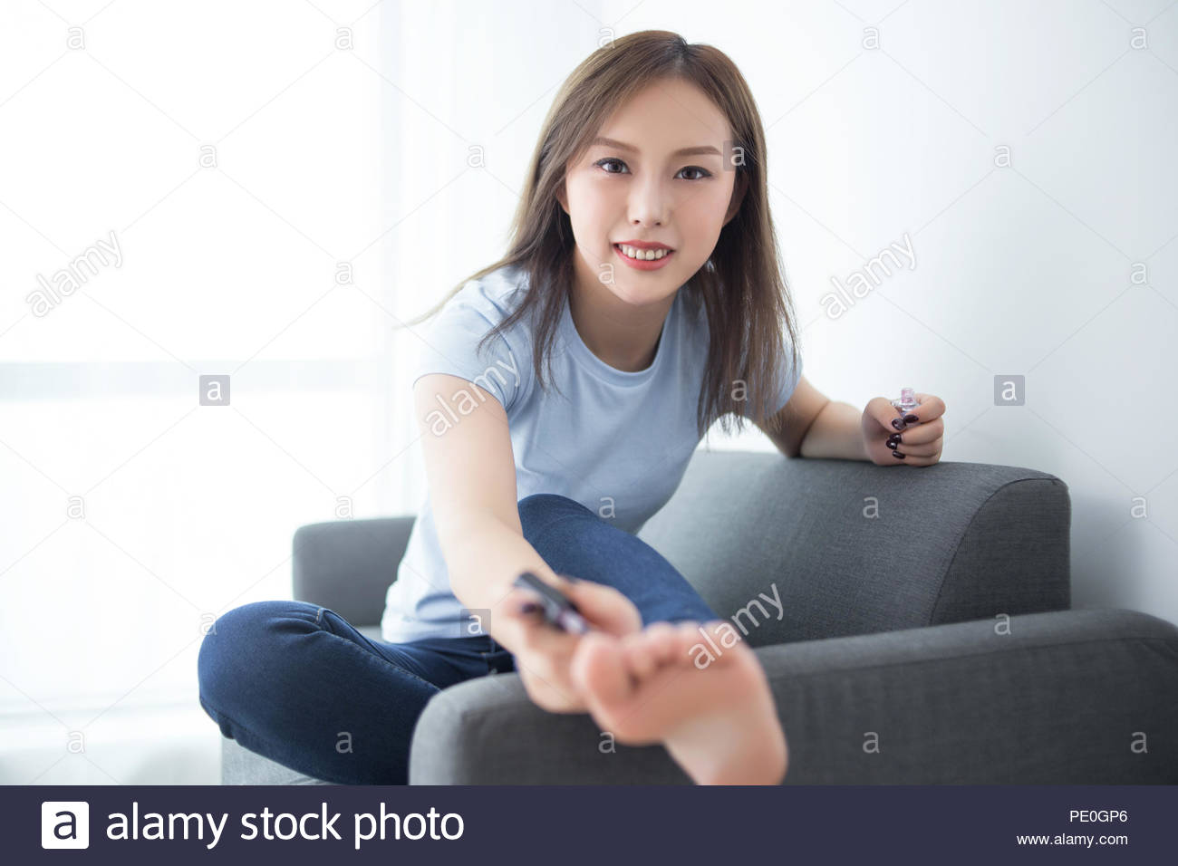 Girl Sit On Couch Paint Nail Polish Stock Photo 215142766 Alamy