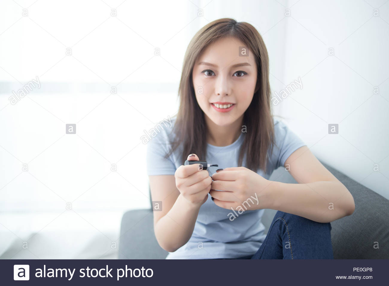 Girl Sit On Couch Paint Nail Polish Stock Photo 215142768 Alamy