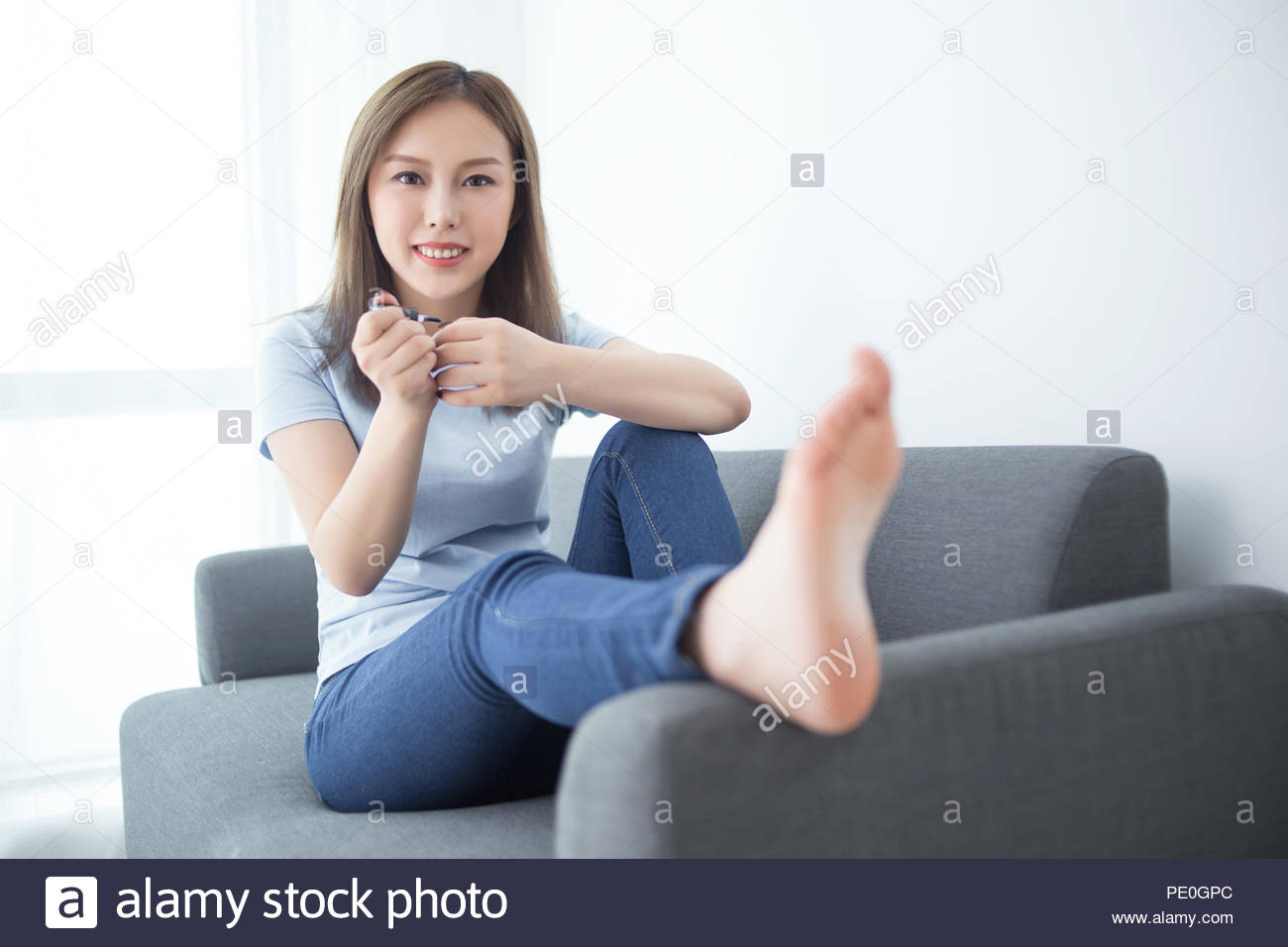Girl Sit On Couch Paint Nail Polish Stock Photo 215142772 Alamy