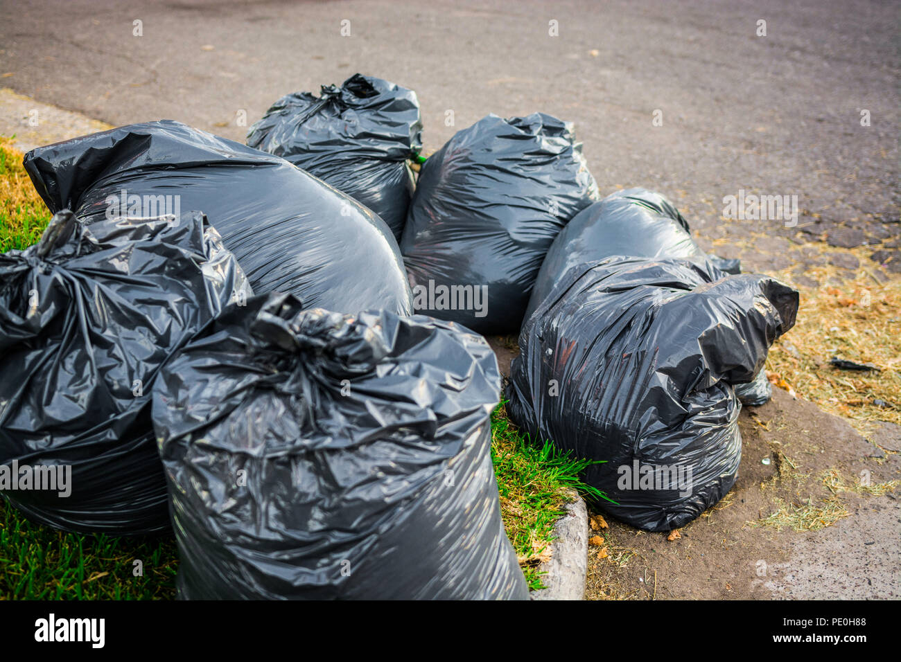 White construction garbage bags. Construction garbage bags piled on top of  one another. A large pile of construction garbage bags. abstract background  Stock Photo - Alamy