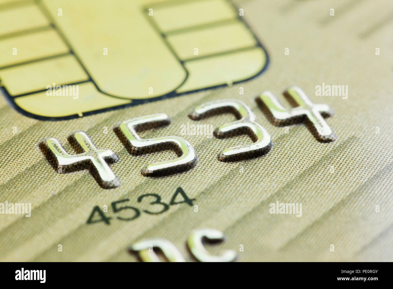 Embossed numbers on credit card close up - USA Stock Photo