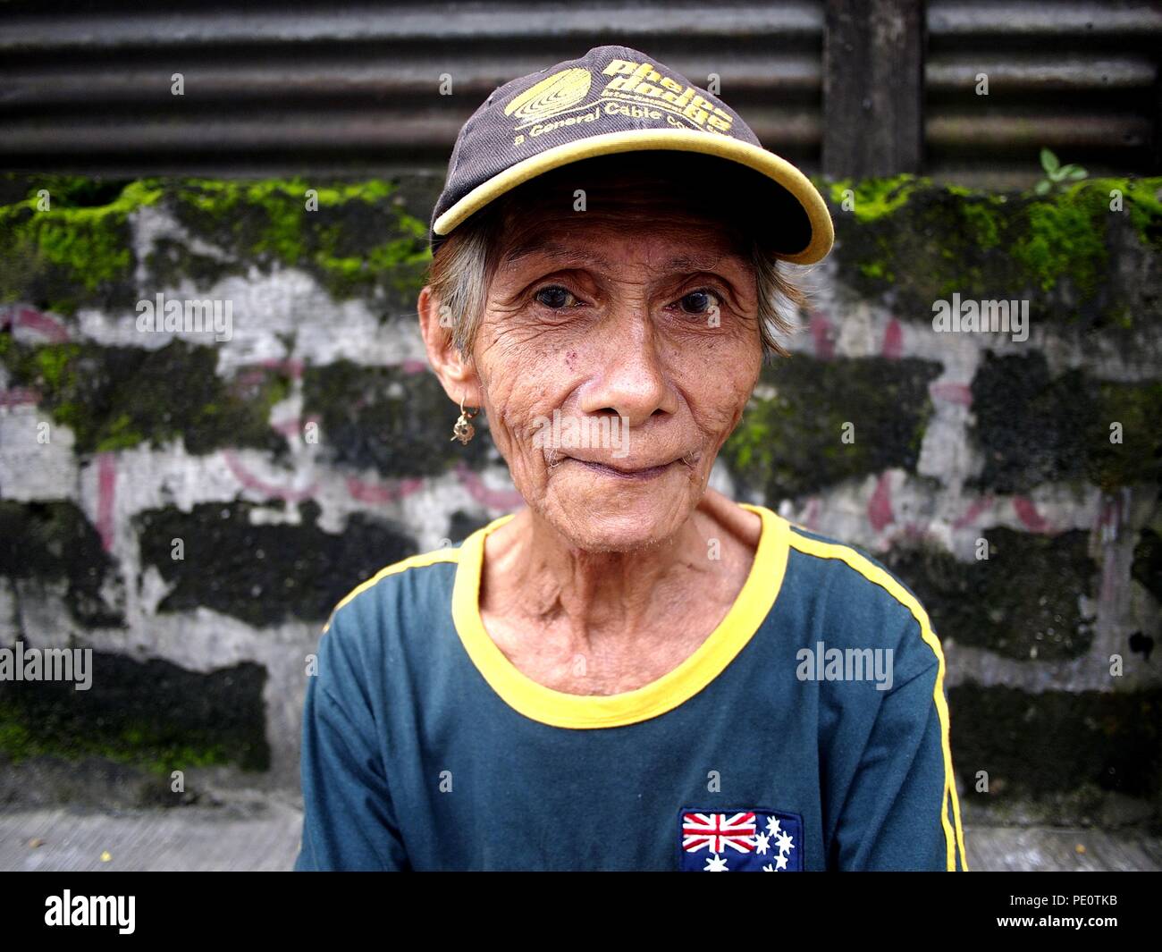 A 60-year-old beautiful filipino woman sitting on he