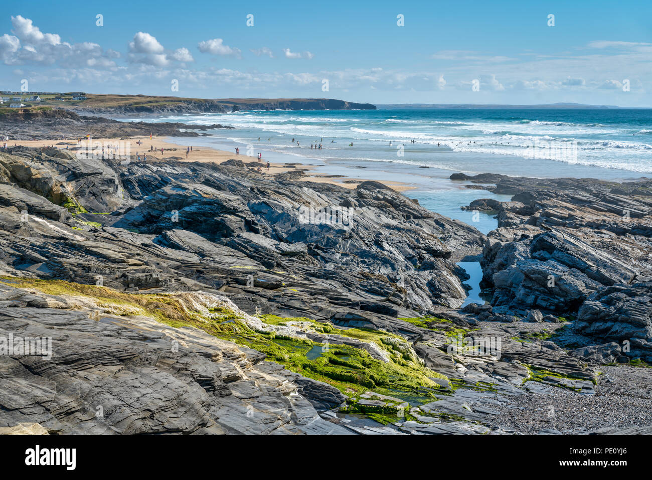 Booby's Bay, Constantine on Cornwalls North Coast showing holiday makers enjoying themselves on the golden sands and in the blue Atlantic Ocean surf. Stock Photo