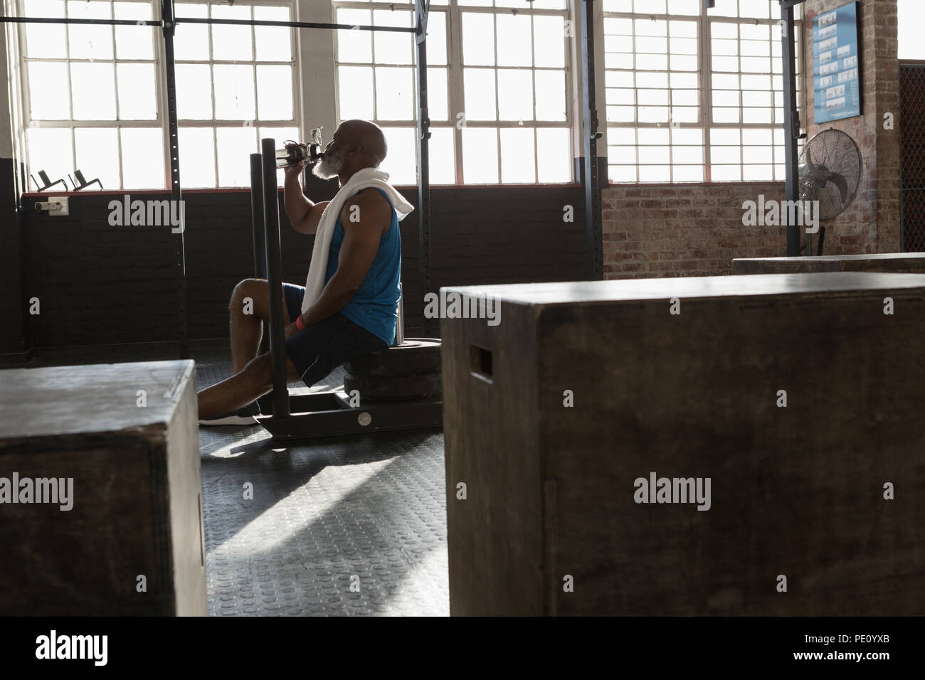 Senior man drinking water after a work out Stock Photo - Alamy