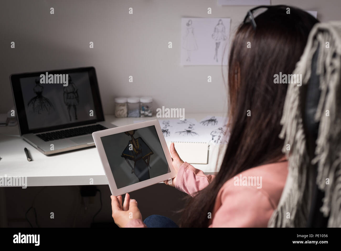 Fashion designer using laptop Stock Photo