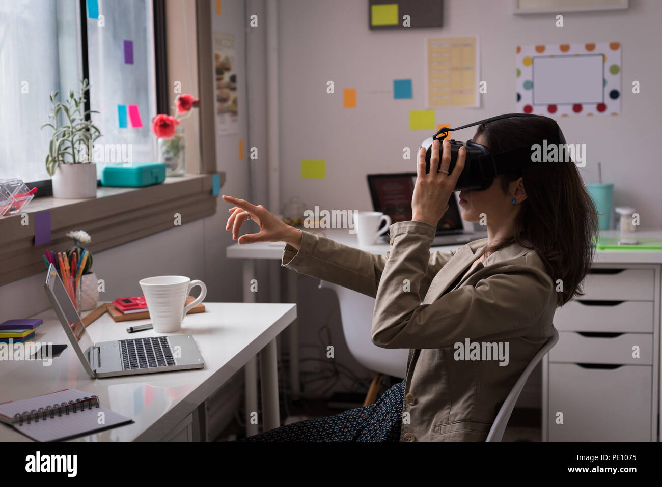 Fashion designer using virtual reality headset Stock Photo