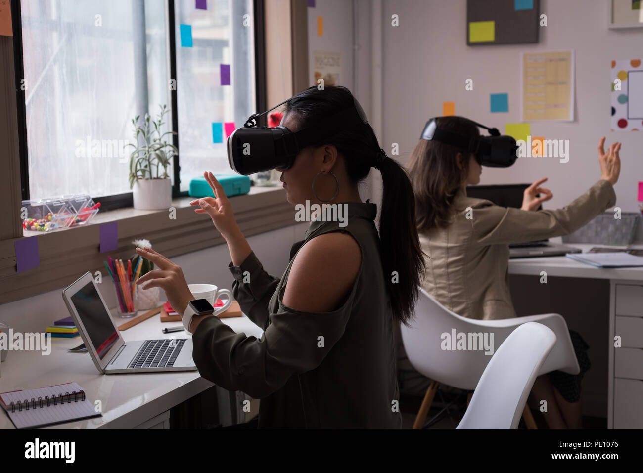 Fashion designers using virtual reality headset in the office Stock Photo