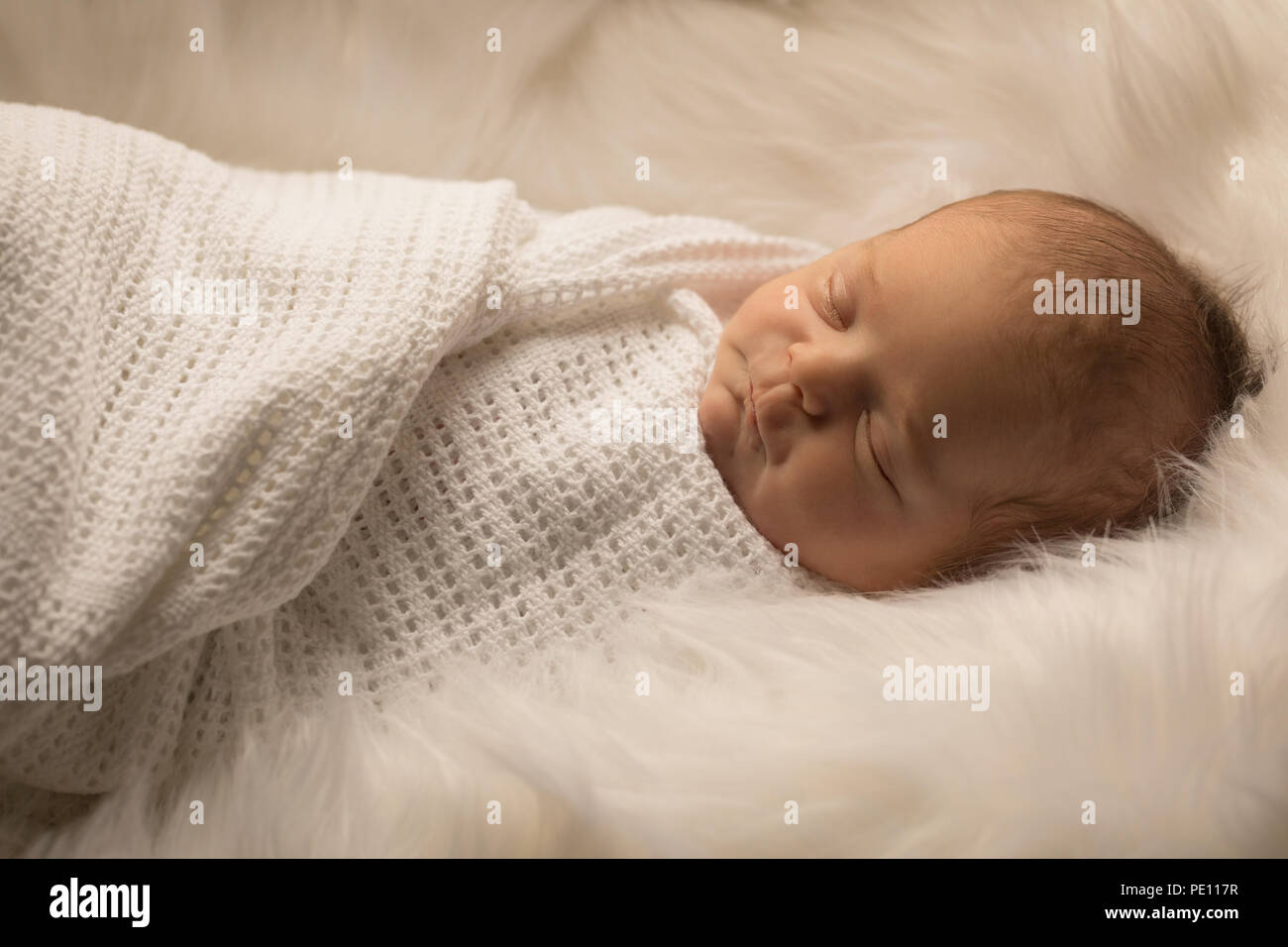 Newborn baby sleeping on baby bed Stock Photo Alamy