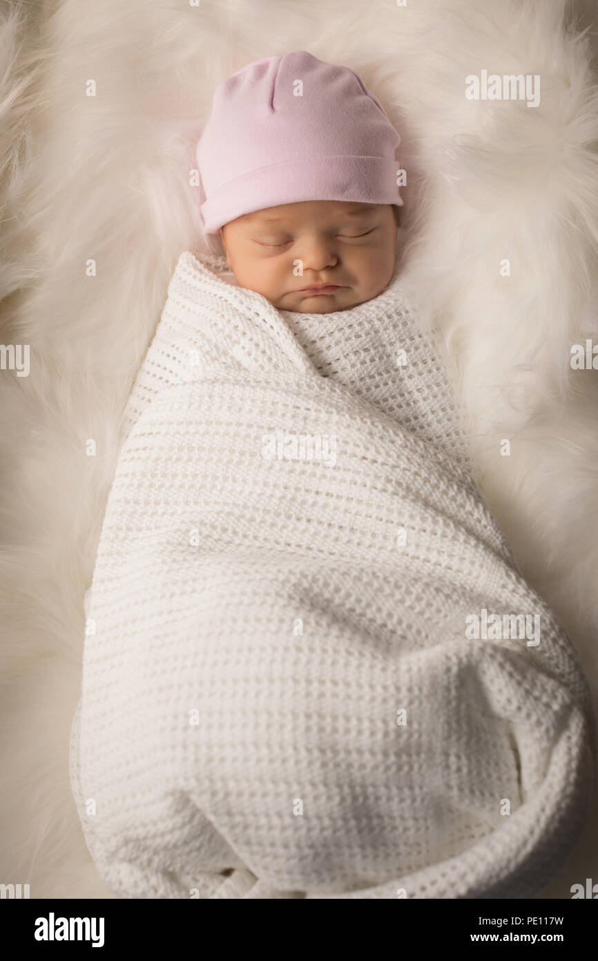 Newborn baby sleeping on baby bed Stock Photo Alamy
