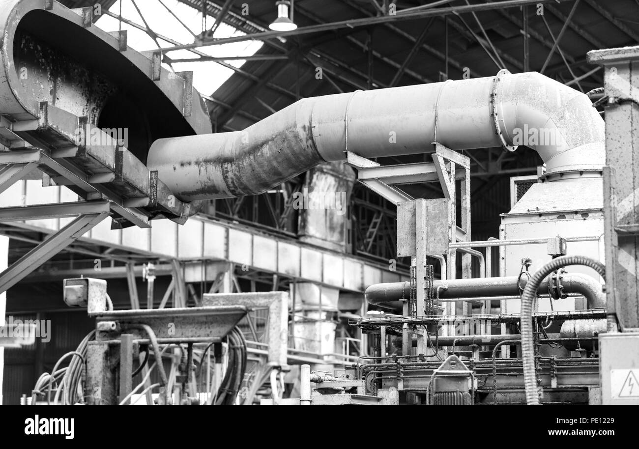 combustion gas extraction system in a foundry. Black and white photography Stock Photo