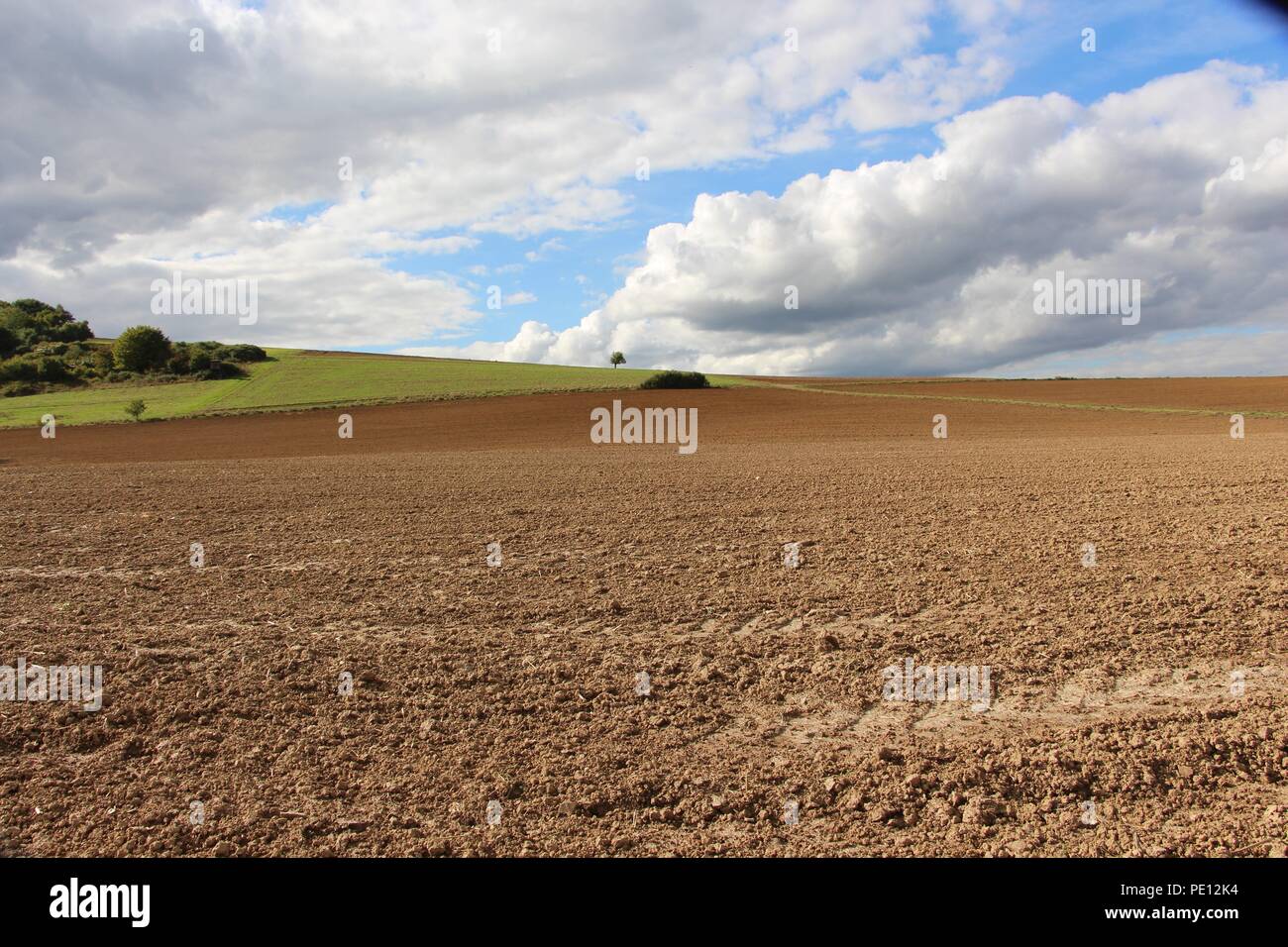 Farmland under Cloudy sky Stock Photo - Alamy