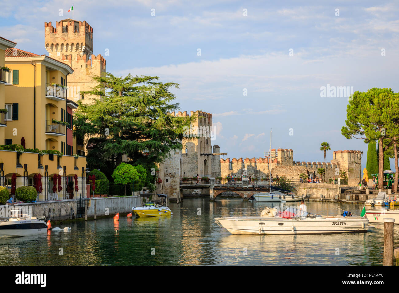 The historic spa town of Sirmione is one of the most picturesque on Lake Garda.  The old fort or Castello is surrounded by water Stock Photo