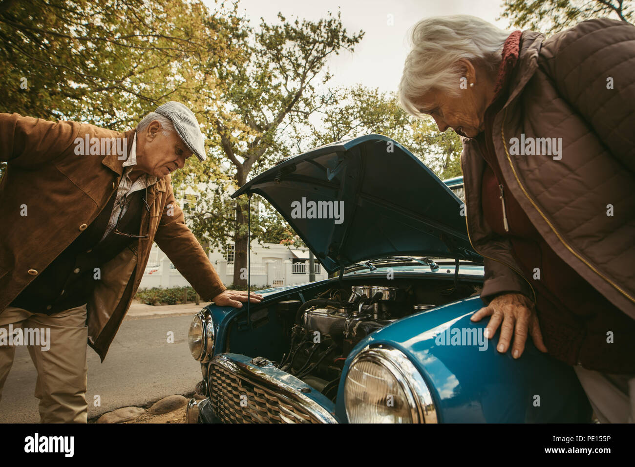Senior Man With Vintage Car In Garage Stock Photo - Download Image