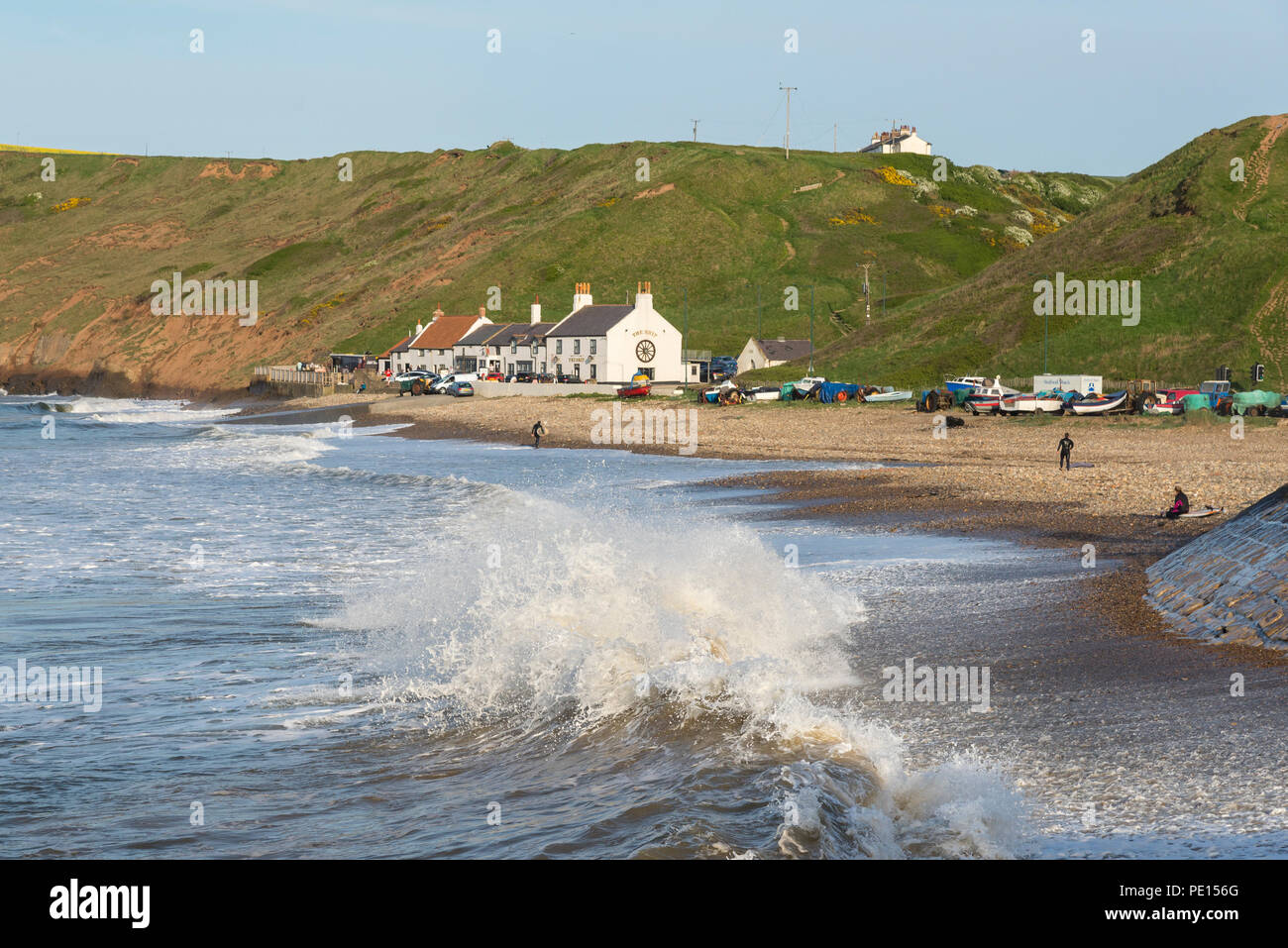 Large waves breaking on the beach at Saltburn-by-the-sea on the coast of North Yorkshire, England. A lovely spring afternoon. Stock Photo