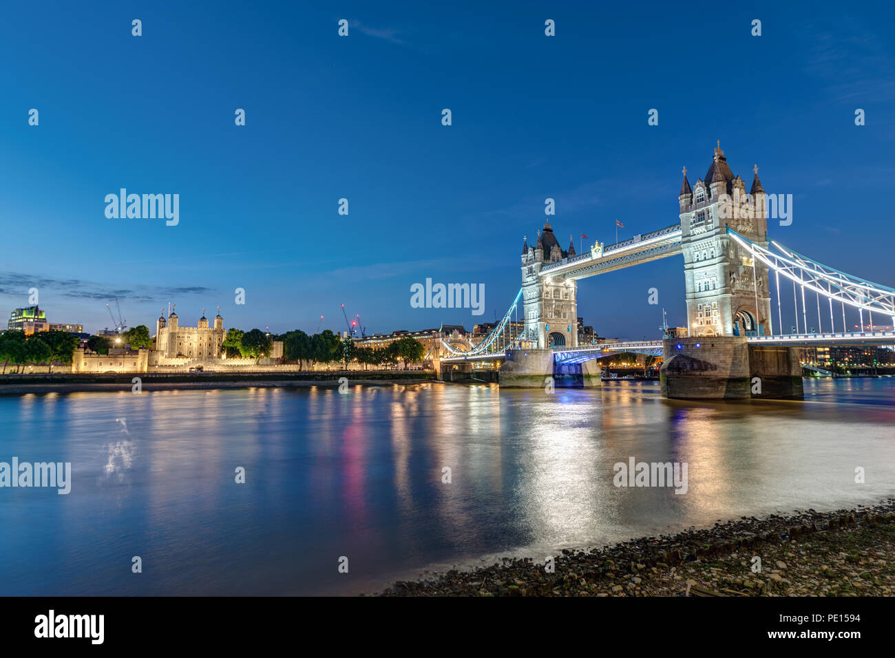 The Tower Bridge and the Tower of London at night Stock Photo