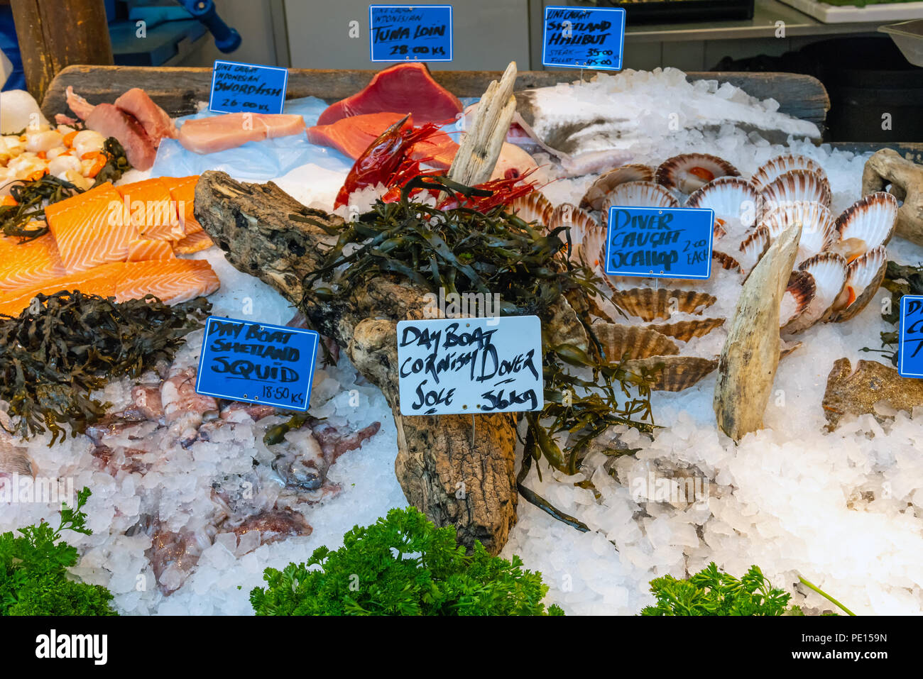 Fish, seafood and scallops for sale at a market in London, UK Stock Photo