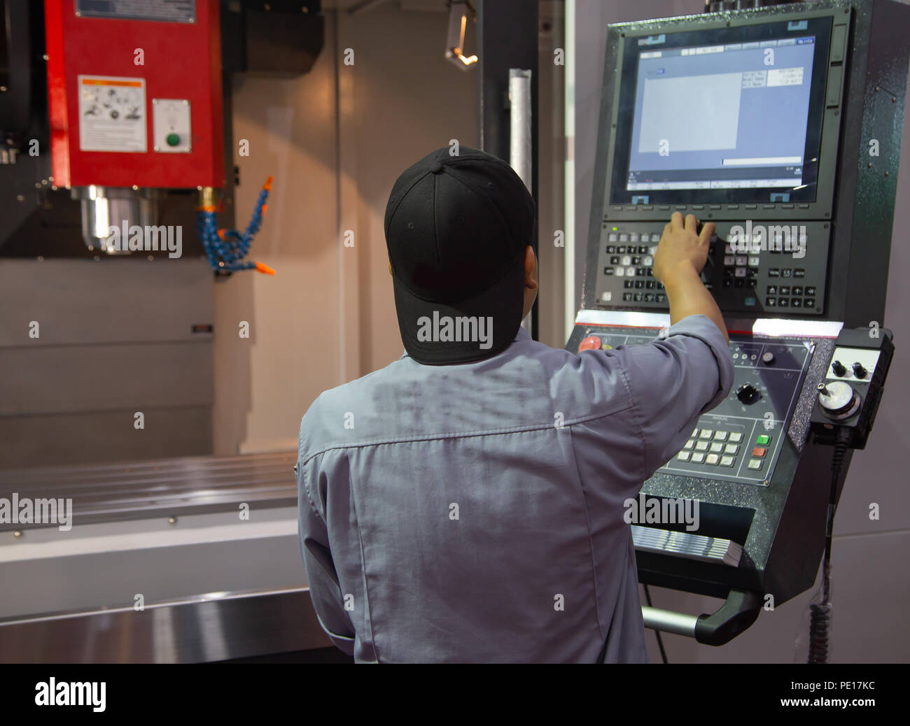 Industrial worker input data programing for CNC milling machine Stock ...
