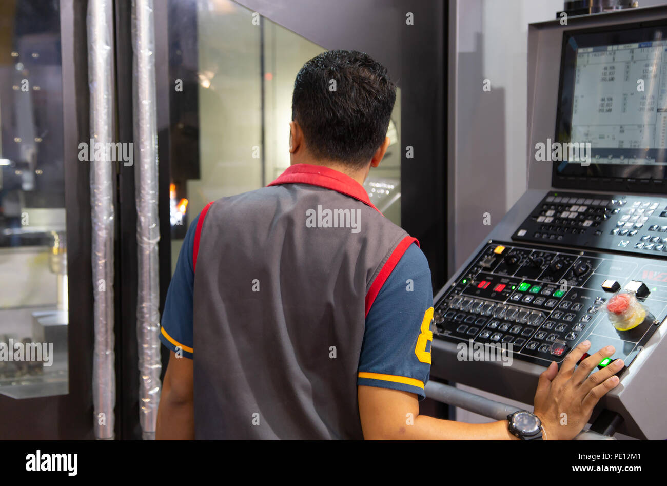Industrial worker input data programing for CNC milling machine Stock ...