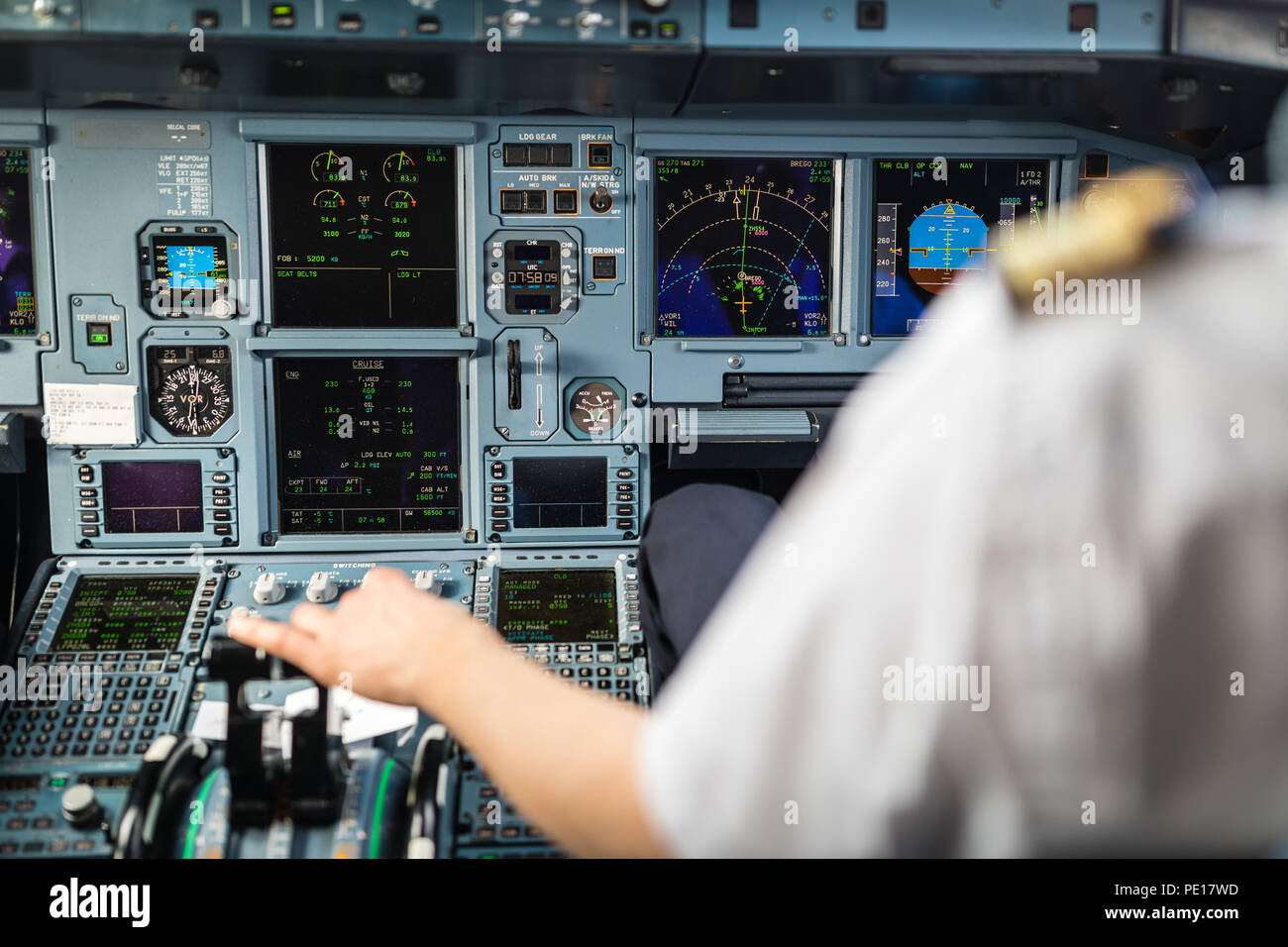 Pilot's hand accelerating on the throttle in a commercial airliner ...