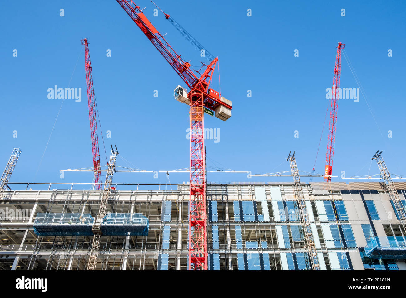 Tower cranes alongside a new high rise building at a construction site, Sheffield, England, UK Stock Photo