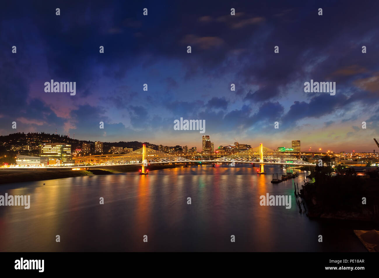 Portland Oregon downtown city skyline by Tilikum Crossing Bridge over Willamette River at night Stock Photo