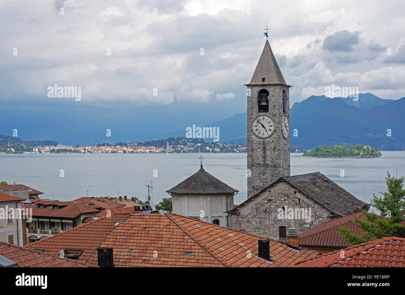 View from roof top terrace of Hotel Rosa Baveno Italy with view of church clock tower and Lago Maggiore Stock Photo