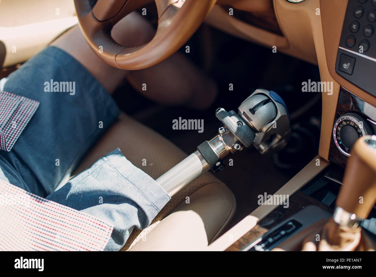 Disabled young man with foot prosthesis drive car Stock Photo Alamy