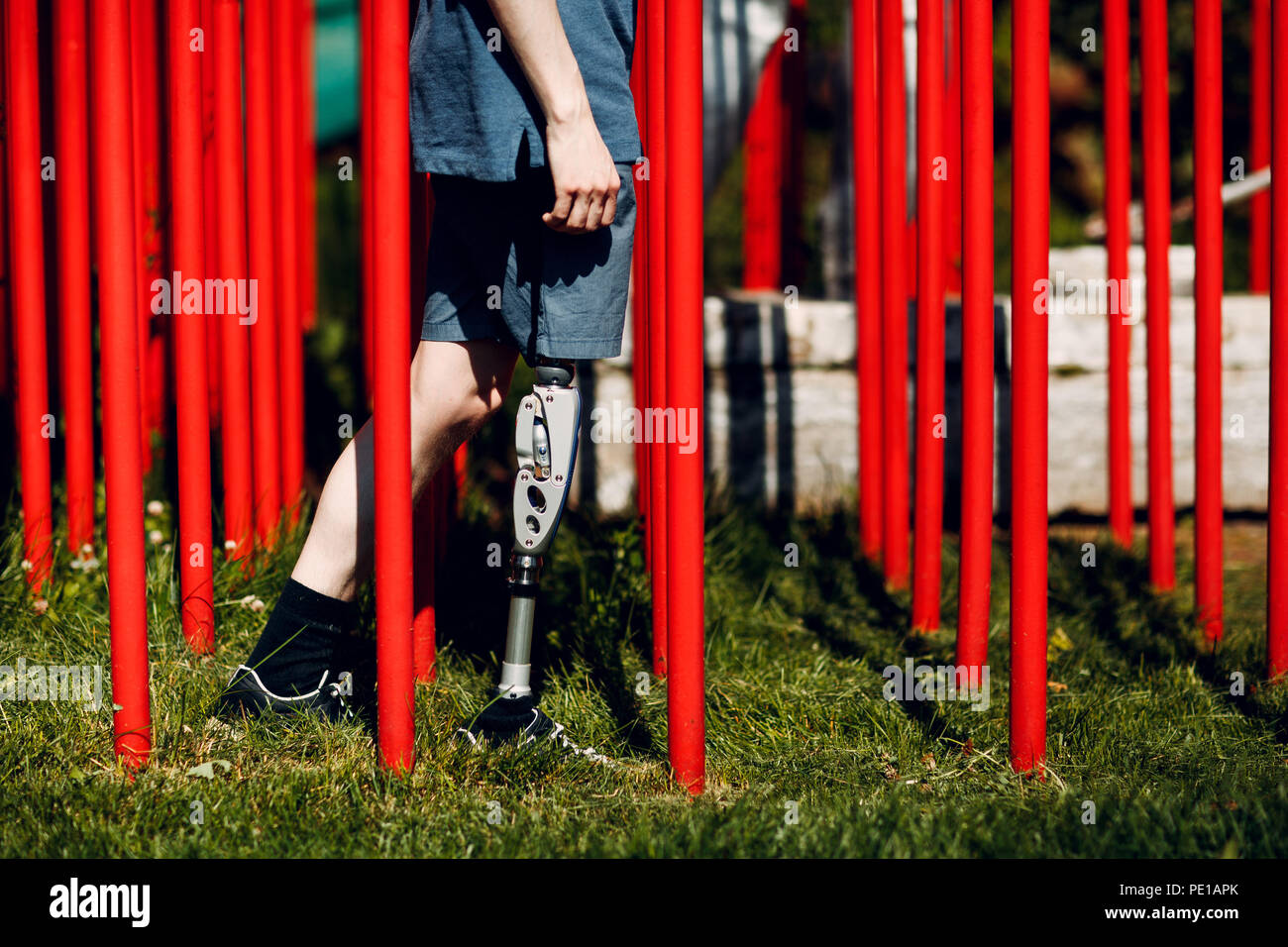 Disabled young man with foot prosthesis Stock Photo