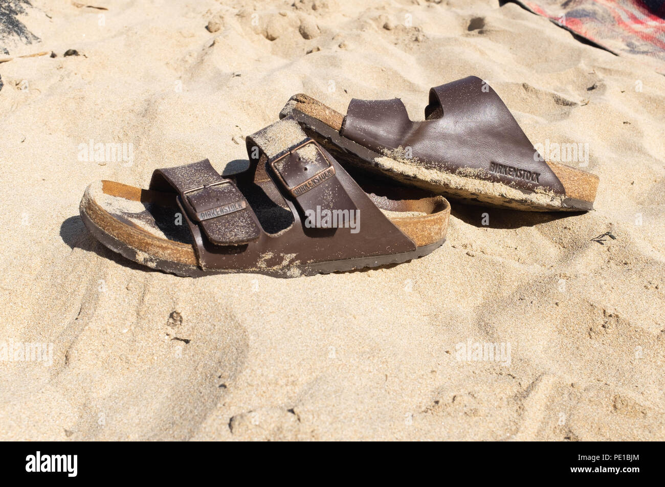 Birkenstock sandals on the beach Stock Photo