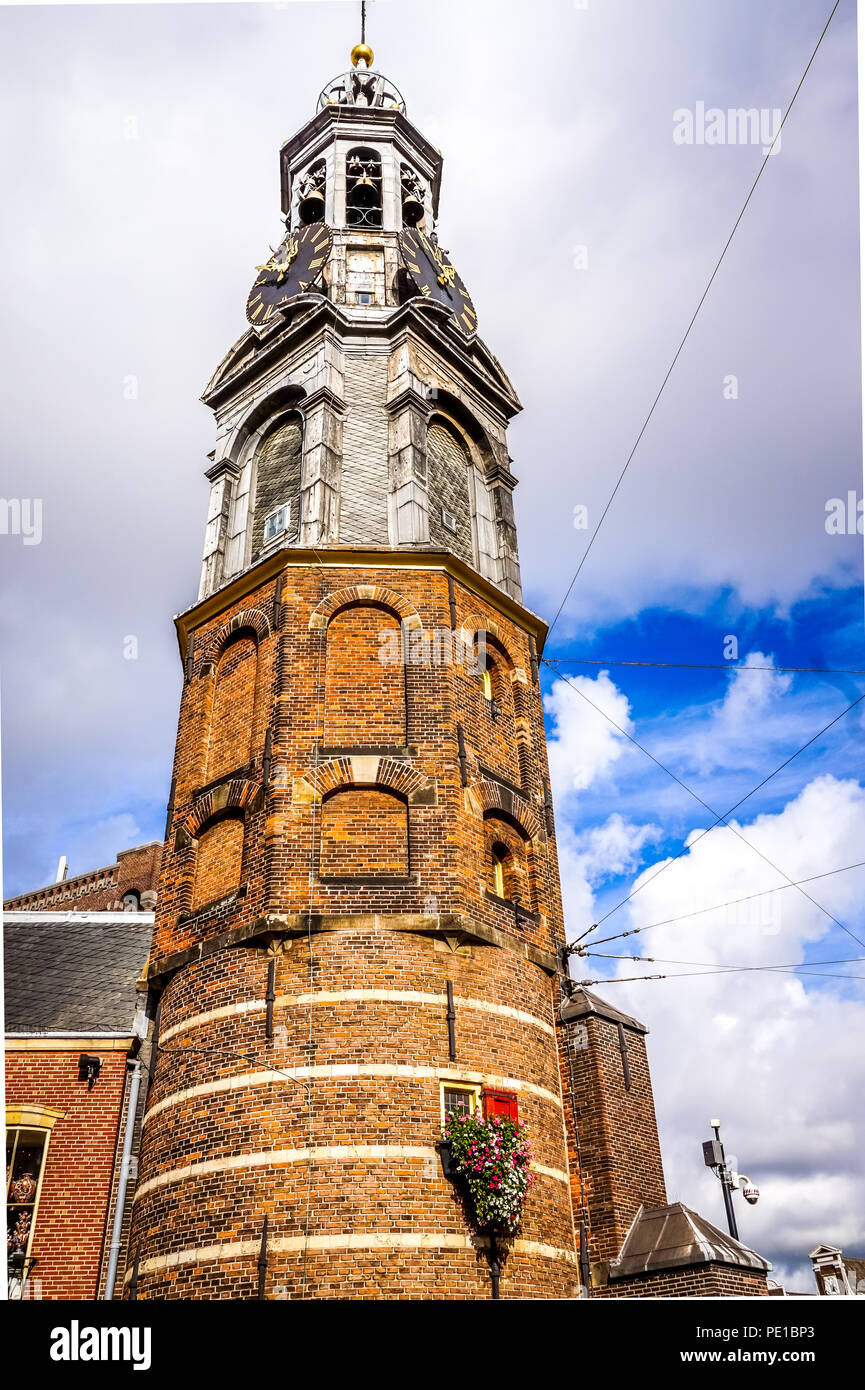 The historic Munttoren or Mint Tower with the famous carillon in the old medieval city wall in the center of Amsterdam, the Netherlands or Holland Stock Photo