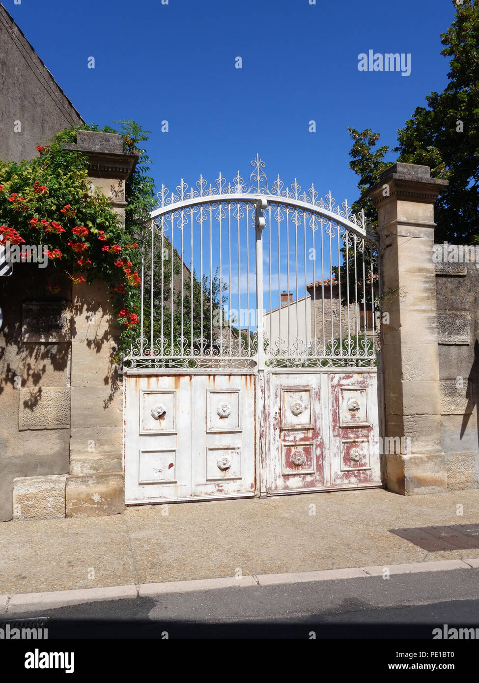 Very large garden gate of a village house in CessenonsurOrb, France