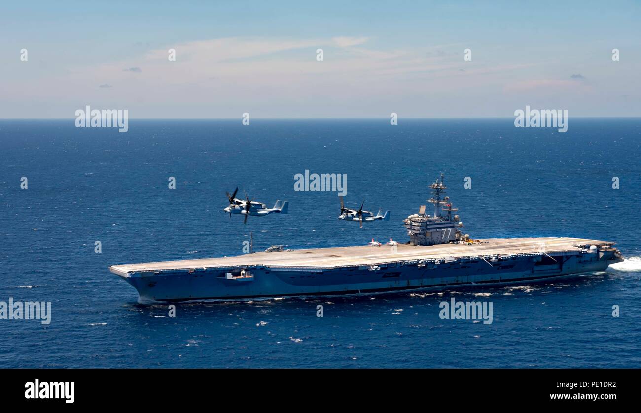 180809-N-JU894-0045 ATLANTIC OCEAN (Aug. 9, 2018) Two MV-22 Osprey, attached to Air Test and Evaluation Squadron (HX) 21, fly over the aircraft carrier USS George H.W. Bush (CVN 77). The ship is underway conducting routine training exercises to maintain carrier readiness.  (U.S. Navy photo by Mass Communication Specialist 3rd Class Brooke Macchietto) Stock Photo