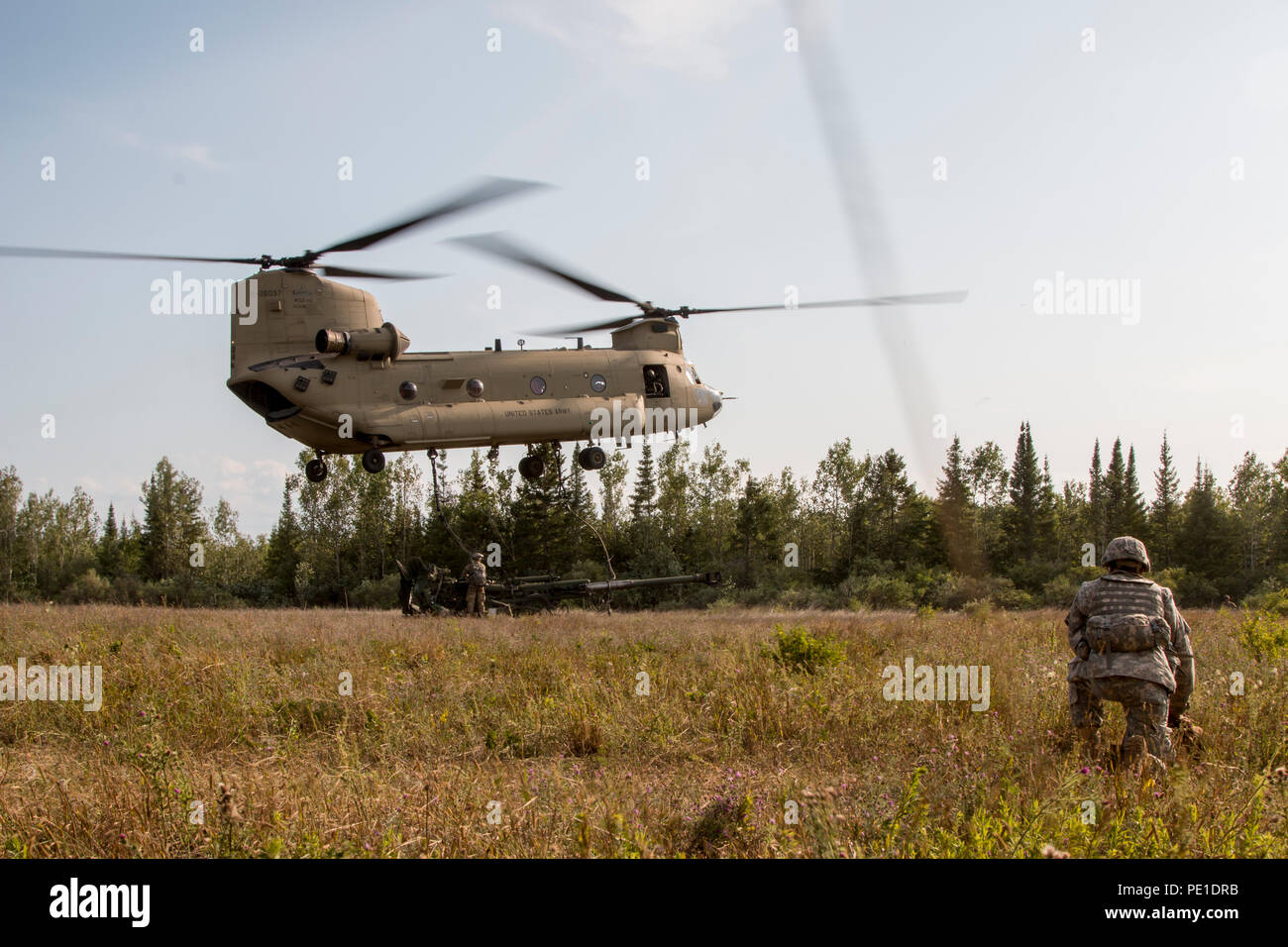 Soldiers with Battery B, 1st Battalion, 103rd Field Artillery Regiment, Rhode Island Army National Guard, conduct a sling load operation for an M777 Howitzer at Camp Grayling, Mich., on Aug. 10, 2018. The 103rd FA is participating in Northern Strike, a joint multinational combined arms live fire exercise involving approximately 5,000 service members from 11 states and six coalition countries. (U.S. Army National Guard photo by Sgt. Tawny Schmit) Stock Photo