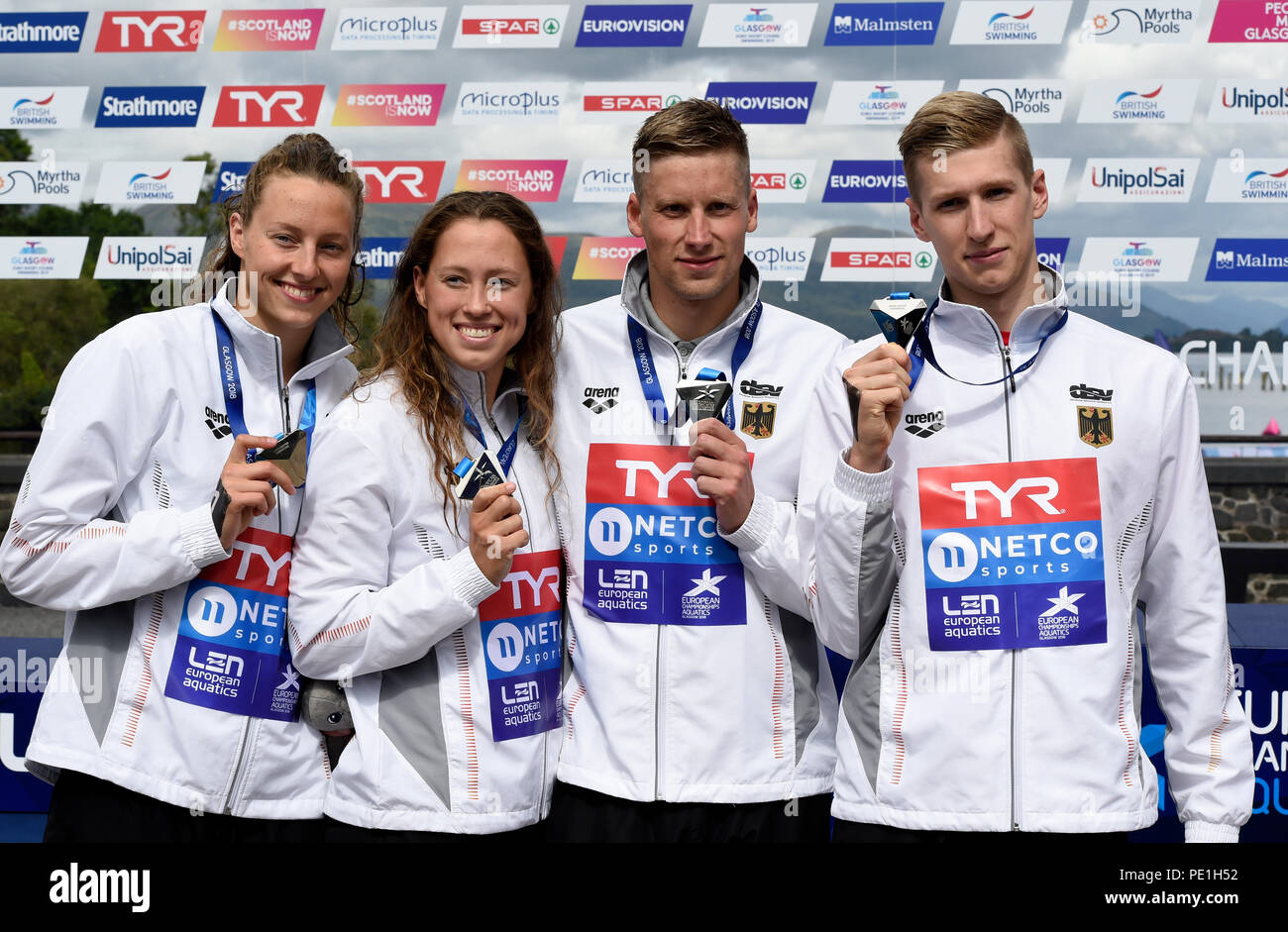 The German team celebrate winning Silver in the Open Water Swimming Mixed Relay during day ten of the 2018 European Championships at Loch Lomond, Stirling. PRESS ASSOCIATION Photo. Picture date: Saturday August 11, 2018. See PA story OPEN European. Photo credit should read: Ian Rutherford/PA Wire. Stock Photo
