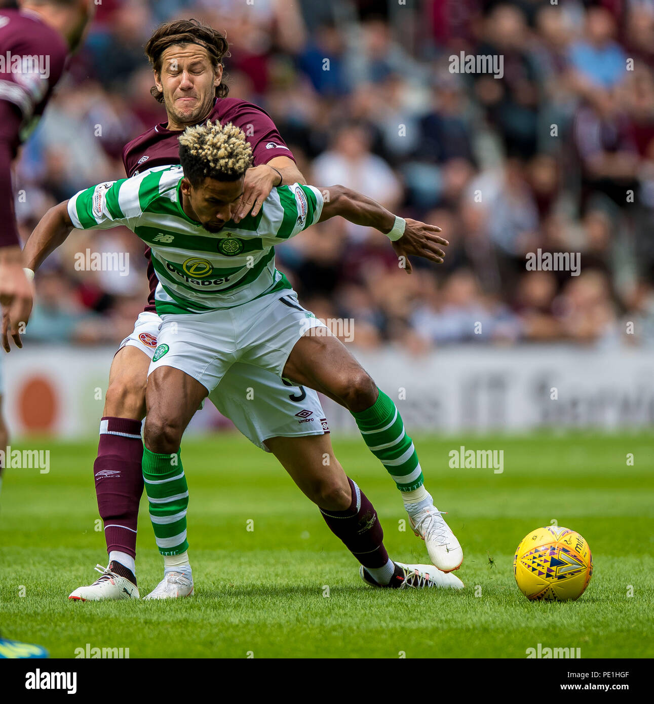 Hearts' Peter Haring and Celtic's Scott Sinclair compete for the ball during the Ladbrokes Scottish Premiership match at Tynecastle Stadium, Edinburgh. Stock Photo