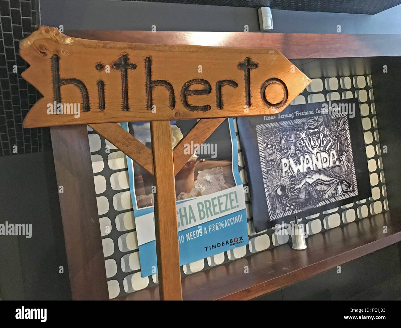 Hitherto sign, at Tinderbox, 118 Ingram St, Glasgow, Scotland, UK Stock Photo