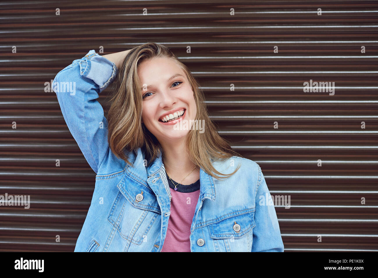 A blonde girl is smiling. Stock Photo