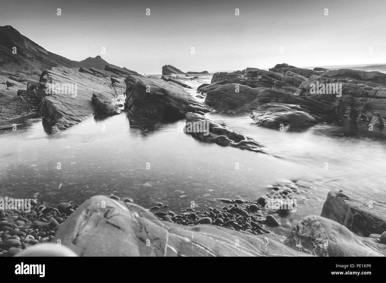 Monochrome of rock formations at Widemouth Bay beach during summer 2018, Bude rock formation, Cornwall, England, UK Stock Photo