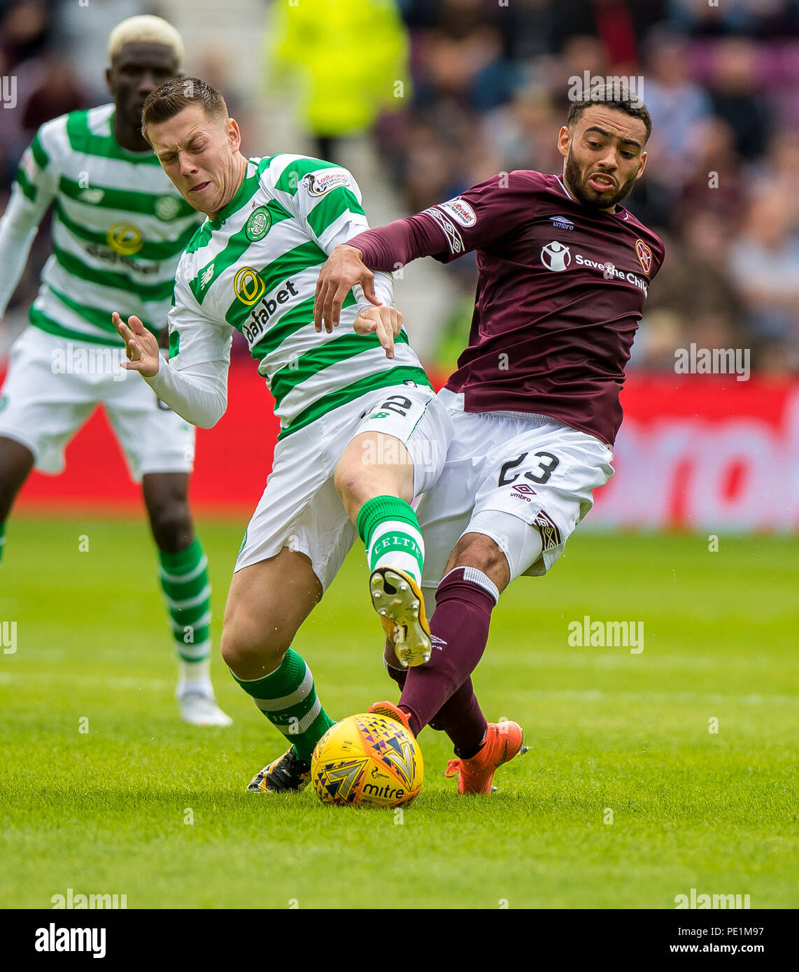 Celtic's Callum McGregor and Hearts' Jake Mulraney compete for the ball during the Ladbrokes Scottish Premiership match at Tynecastle Stadium, Edinburgh. PRESS ASSOCIATION Photo. Picture date: Saturday August 11, 2018. See PA story soccer Hearts. Photo credit should read: Craig Watson/PA Wire. EDITORIAL USE ONLY Stock Photo