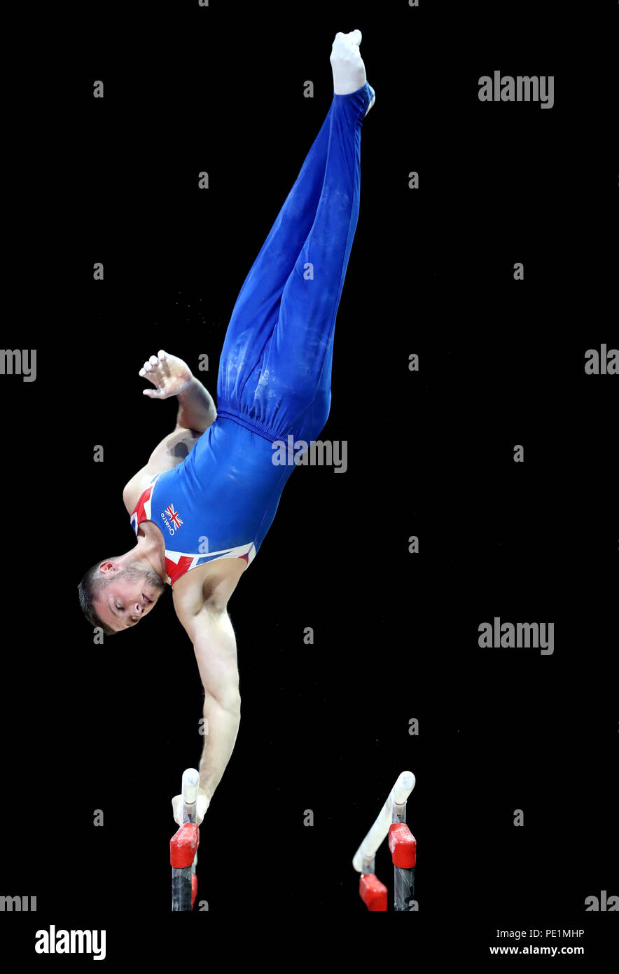Great Britain's Dominick Cunningham competes on the parallel bars in