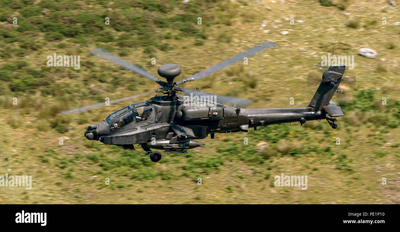 Army Apache Helicopter low level flying traing in the Mach Loop Stock Photo
