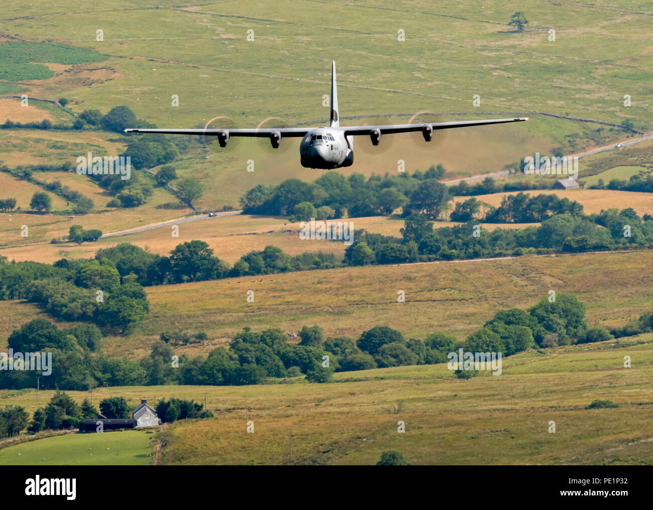 Royal Canadian Air Force, CC-130J Super Hercules 614, flying low level in the Mach Loop Stock Photo