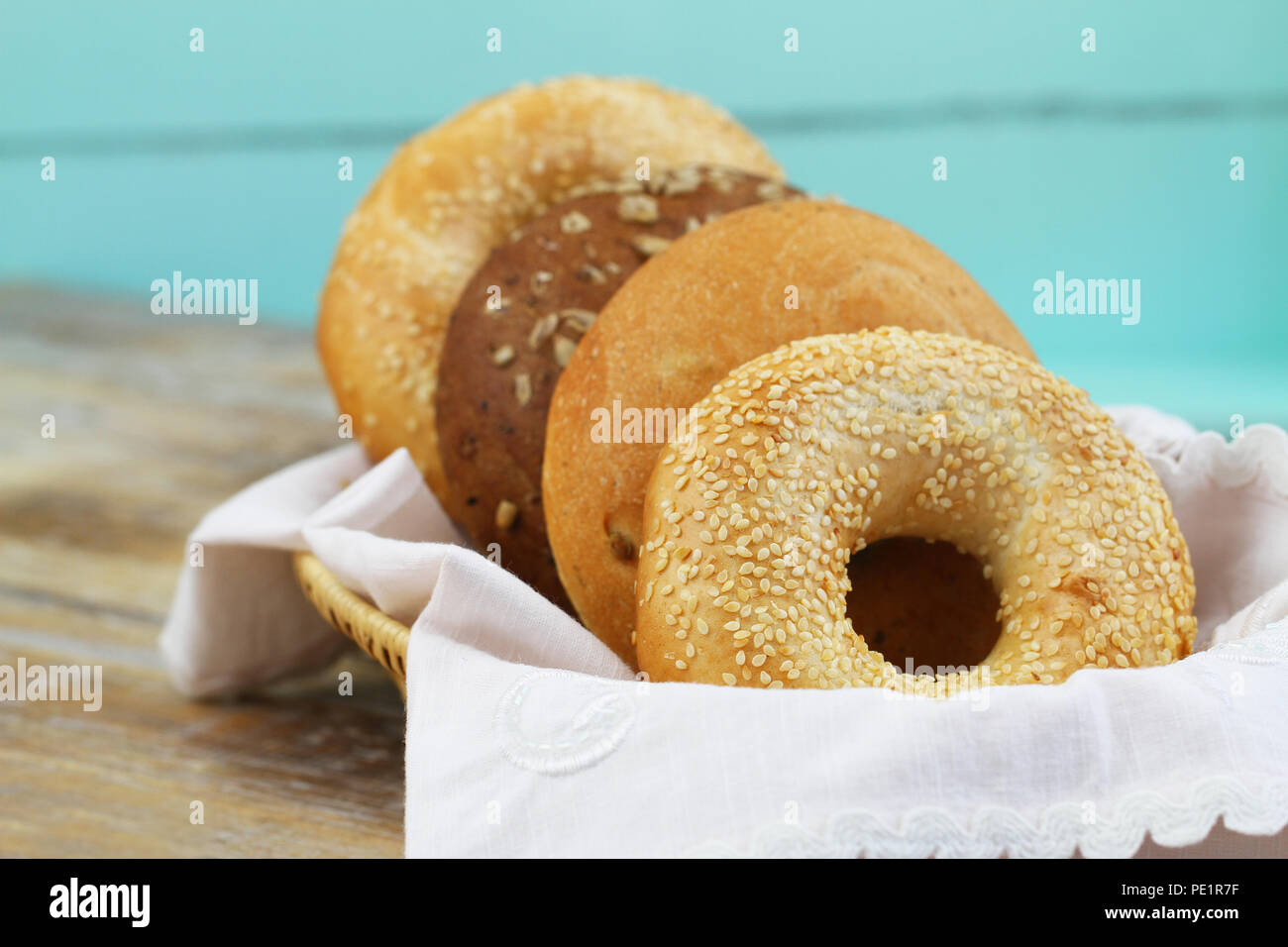 Freshly baked bagels in bread basket with copy space Stock Photo