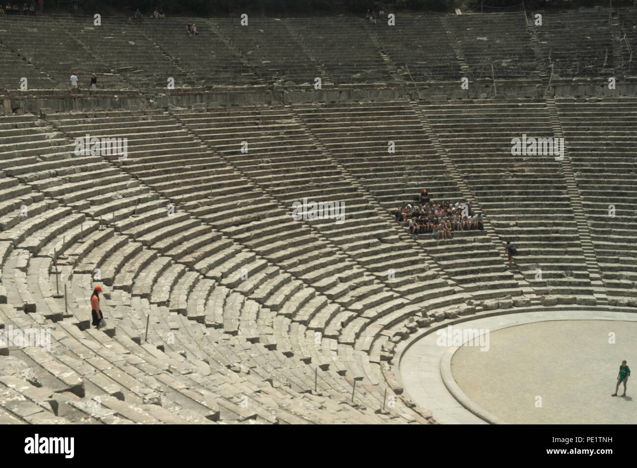 Greece, the ancient theater at Epidavros. Perfectly prserved and with perfect acoustics.  From the back row you can hear a pin drop on the stage below Stock Photo