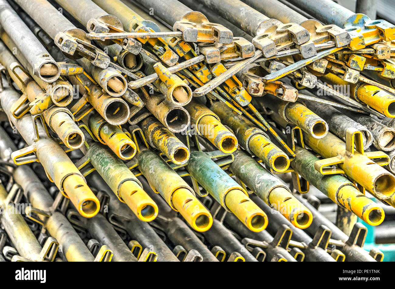 Stack of scaffolding pipes on a building site Stock Photo - Alamy