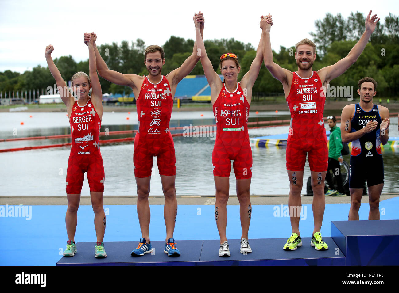 Silver medal winners Switzerland's Lisa Berger, Andrea Salvisberg, Nicola Spirig and Sylvain Fridelance for the Triathlon Mixed team relay during day ten of the 2018 European Championships at Strathclyde Country Park, Lanarkshire. PRESS ASSOCIATION Photo. Picture date: Saturday August 11, 2018. See PA story TRIATHLON European. Photo credit should read: John Walton/PA Wire. RESTRICTIONS: Editorial use only, no commercial use without prior permission Stock Photo