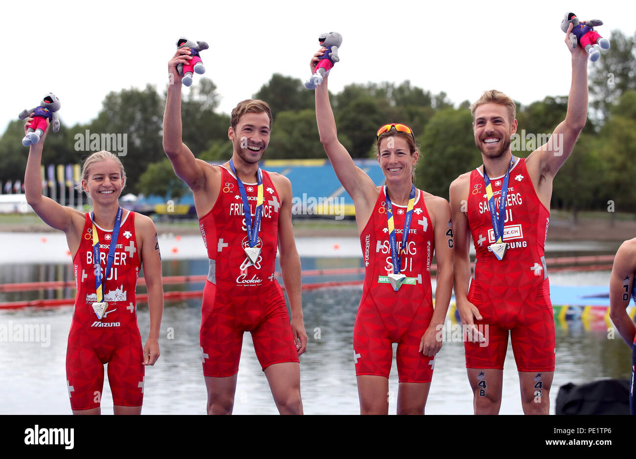 Silver medal winners Switzerland's Lisa Berger, Andrea Salvisberg, Nicola Spirig and Sylvain Fridelance for the Triathlon Mixed team relay during day ten of the 2018 European Championships at Strathclyde Country Park, Lanarkshire. PRESS ASSOCIATION Photo. Picture date: Saturday August 11, 2018. See PA story TRIATHLON European. Photo credit should read: John Walton/PA Wire. RESTRICTIONS: Editorial use only, no commercial use without prior permission Stock Photo
