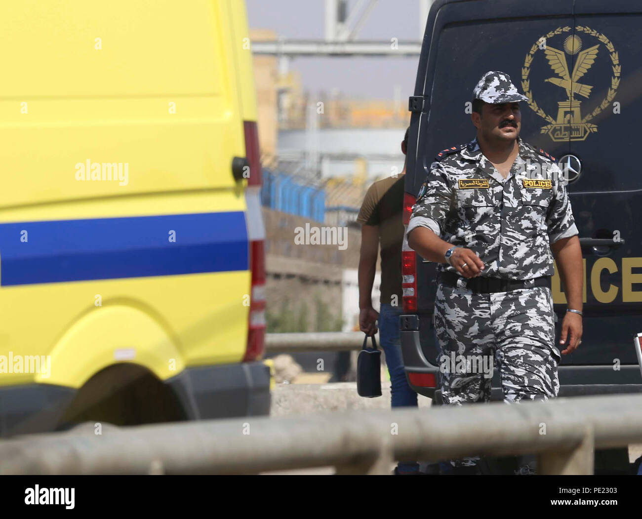Cairo. 11th Aug, 2018. A police officer stands guard at the site where a suicide bomber detonated his explosive belt in Cairo, Egypt, Aug. 11, 2018. Egyptian forces have thwarted on Saturday an attempted attack on a church in Cairo before the suicide bomber infiltrating into the crowd, state-run Ahram news website reported. Credit: Xinhua/Alamy Live News Stock Photo
