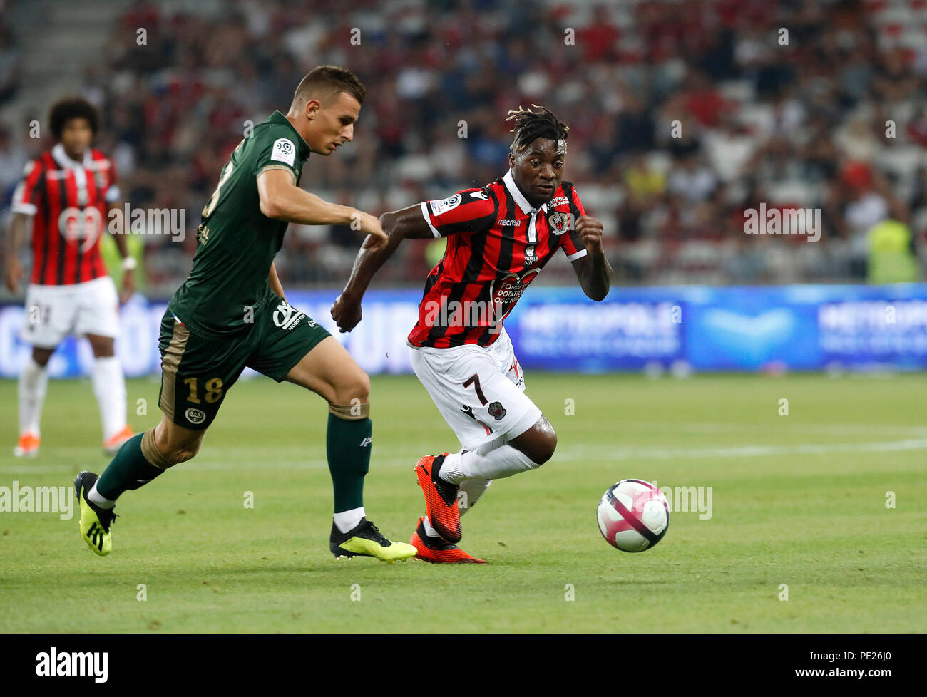 Nice, France. 11th Aug, 2018. Allan Saint-Maximin (R) of Nice vies with  Remi Oudin of Reims during the French Ligue 1 football match 2018-19 season  1st round in Nice, France on Aug.